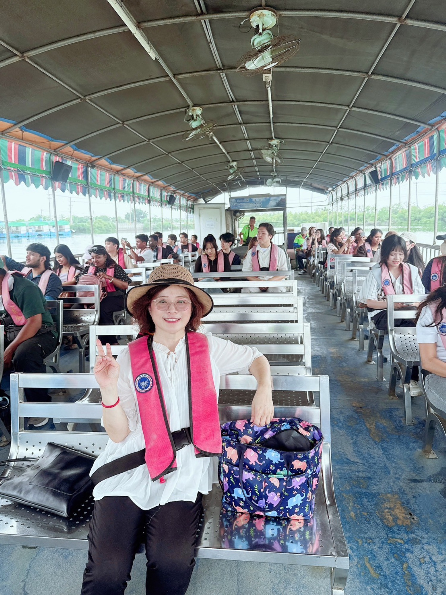 Instructor Lin-Lin Fan and students enjoy the stunning intersection of nature and history at the Sicao Green Tunnel