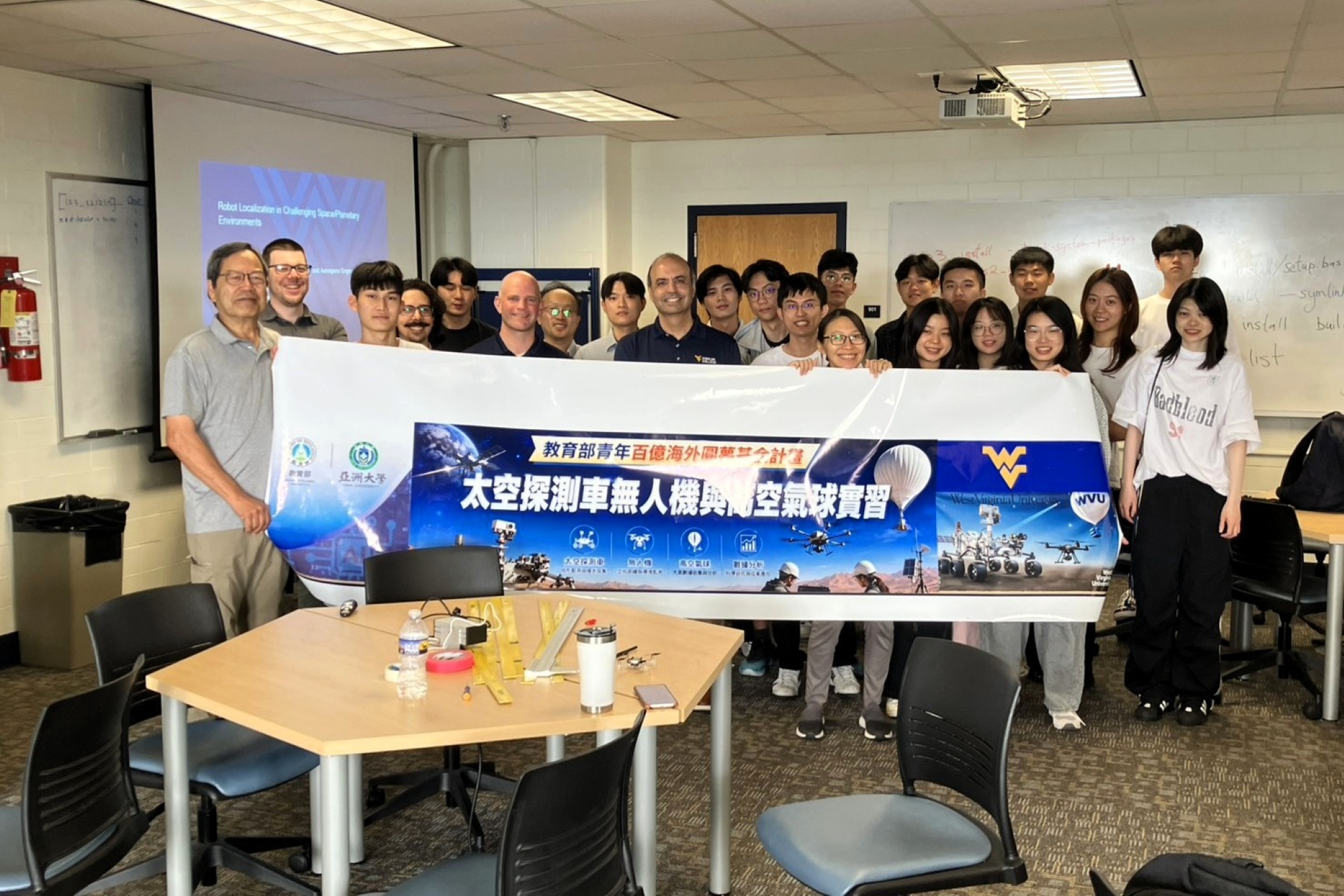 Group photo of the Dean of the College of Engineering and the Chair of the Department of Mechanical, Materials and Aerospace